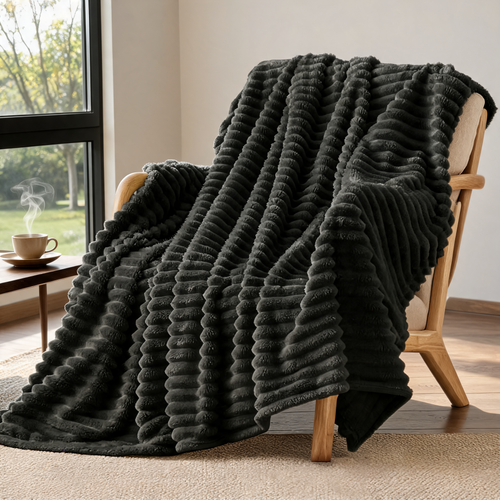 Ribbed fleece throw blanket over an armchair by the window