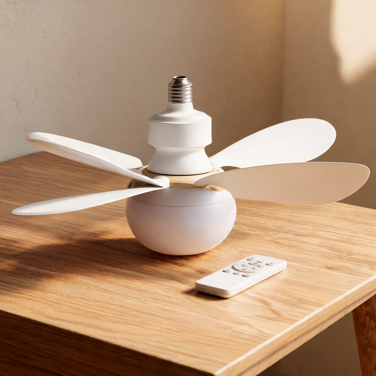 Bulb socket fan light with its remote on a bedside table